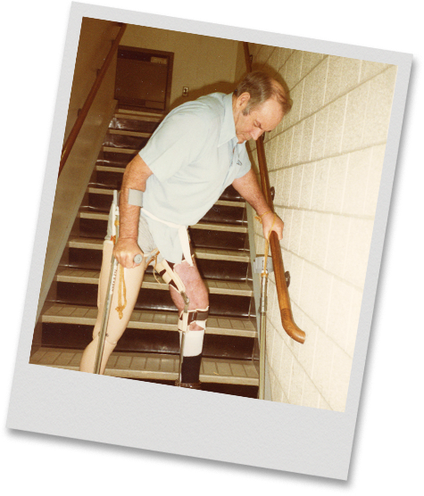 Ted Eagan climbing stairs on prosthetics during recovery